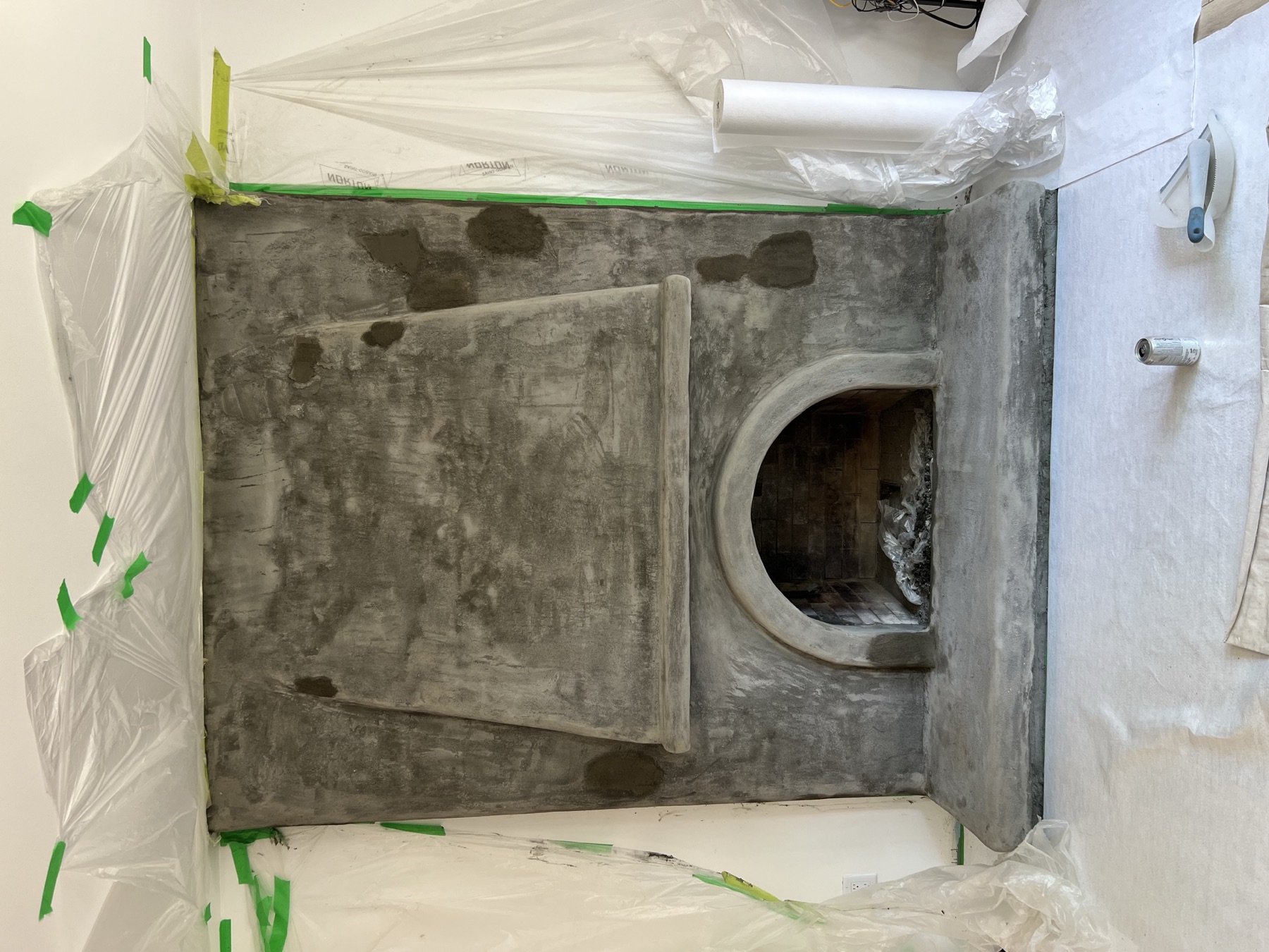 Prepared fireplace surface during the Brookswood Marmorino project